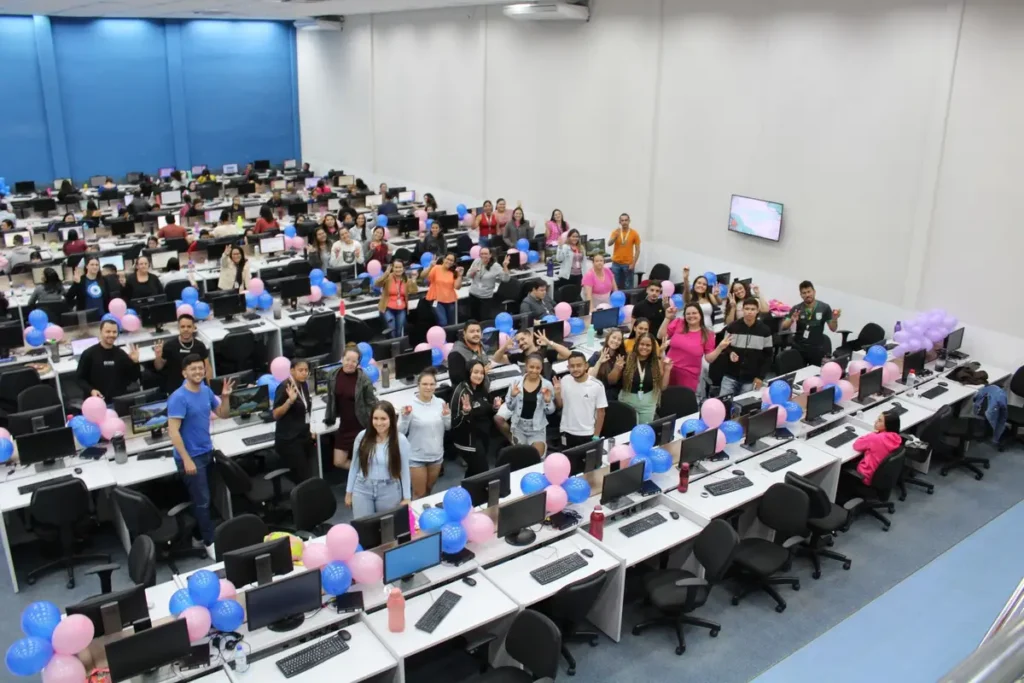 Cheerful office celebration with colorful balloons and diverse team indoors.