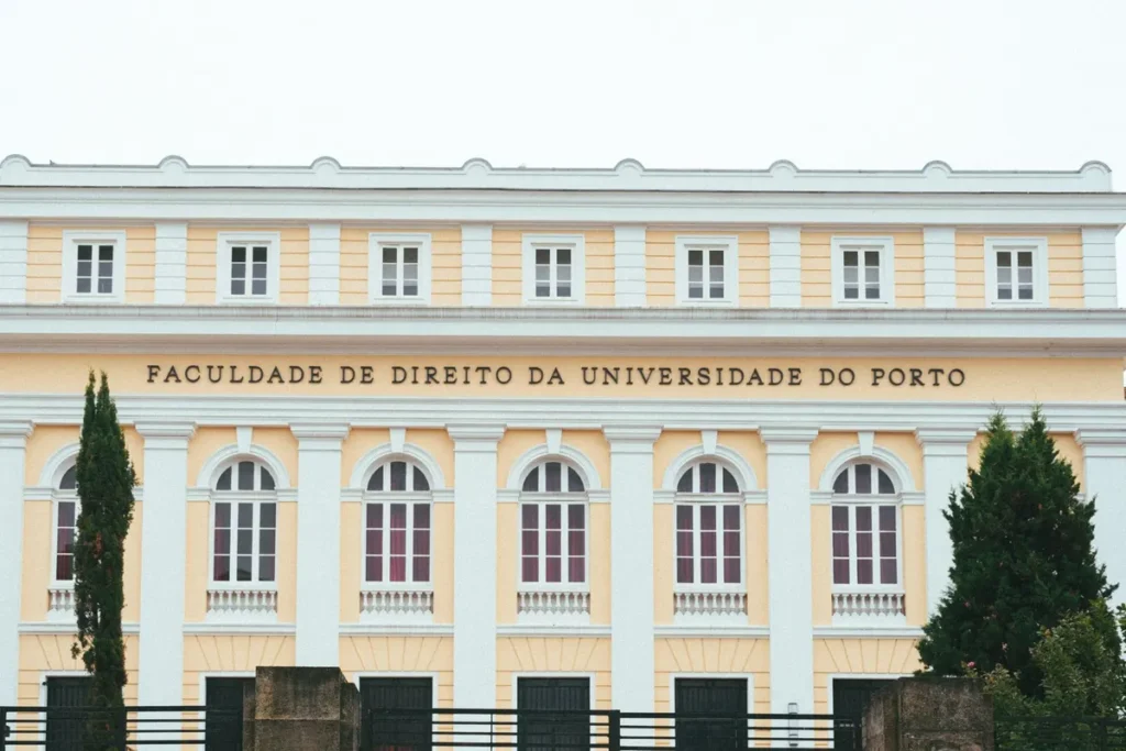 Facade of the Faculty of Law at the University of Porto, showcasing classic architecture.